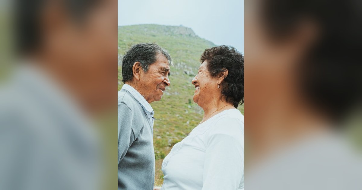 healthy elderly couple smiling outside